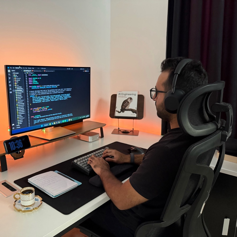 Shamil Lateef at his desk, writing code